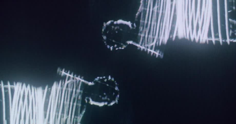 A blackandwhite animation shows a woman dancing across multiple exposures on a screen