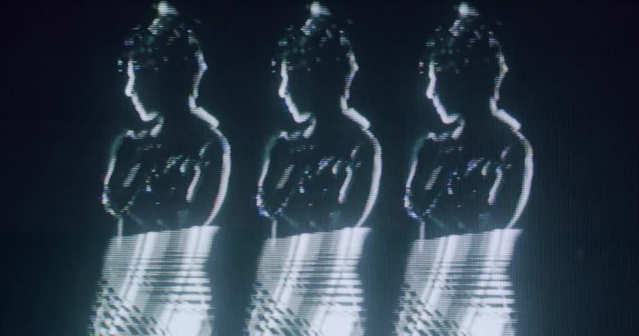 The figures dance in the dark hologram