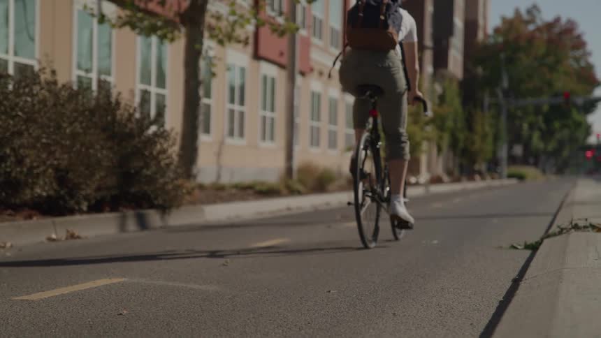 Woman riding a bicycle on an urban street