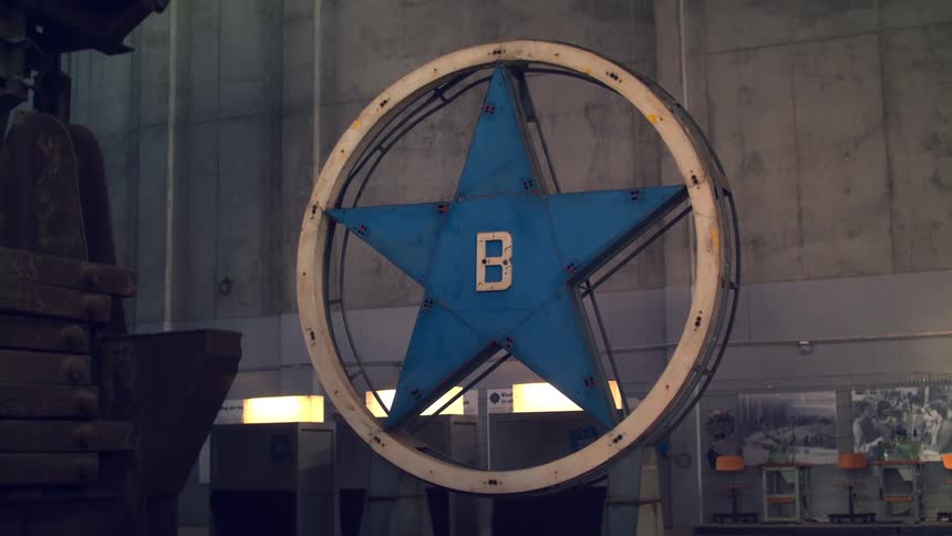 Large blue star with the letter b in the center on industrial display