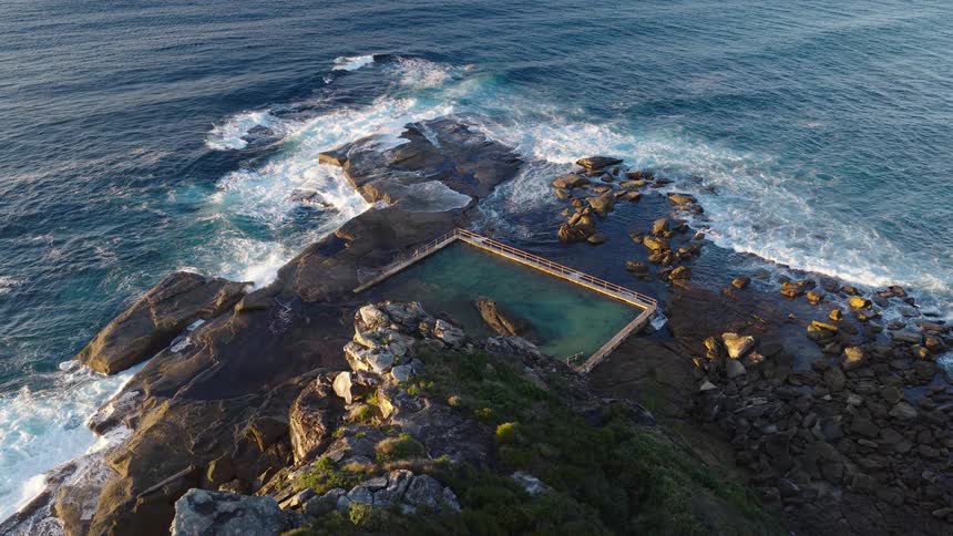 A salt water pool on a promontory at sea level