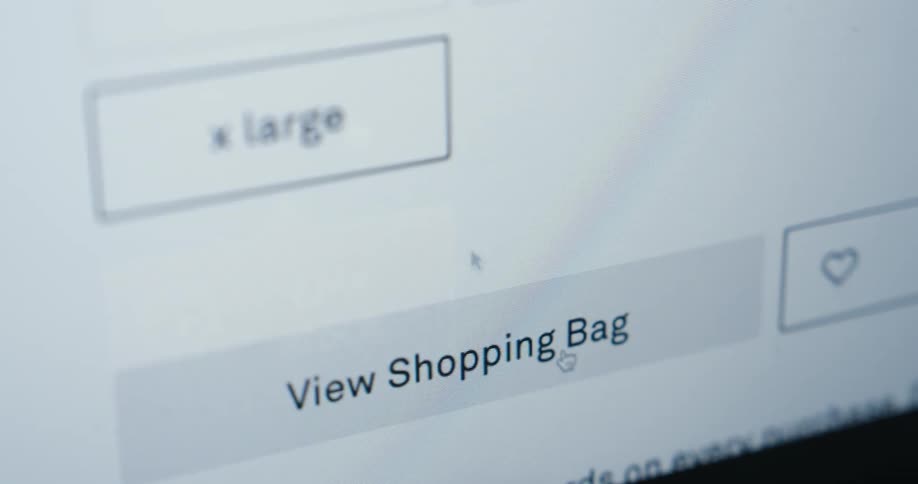 A mouse cursor clicking on a add to shopping bag button in a clothes shopping website