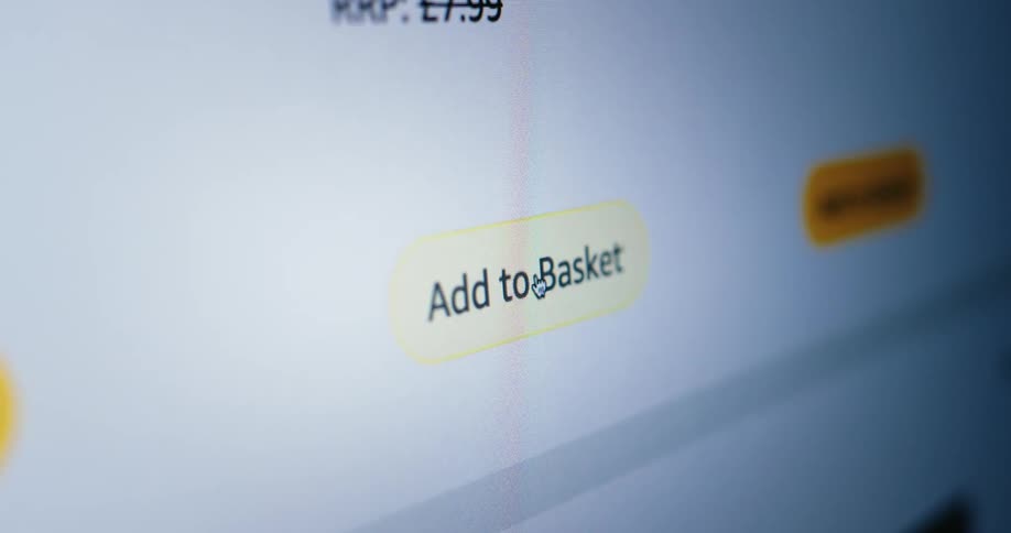 A mouse clicking on an add to basket button on a shopping website
