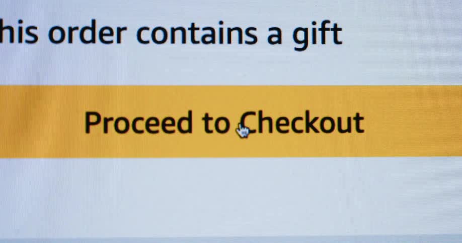 A computer mouse clicks on a button to proceed to checkout