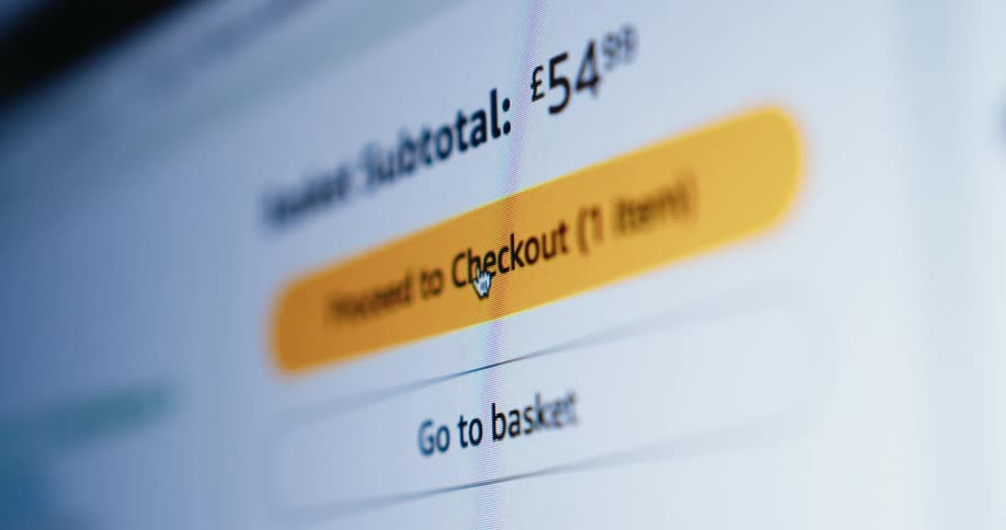 Using a computer a person is making an online purchase