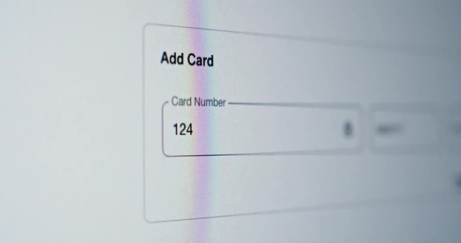 A credit card number is typed into a field in order to make an online purchase