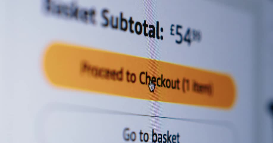 A mouse cursor clicking on a proceed to checkout button on a shopping website