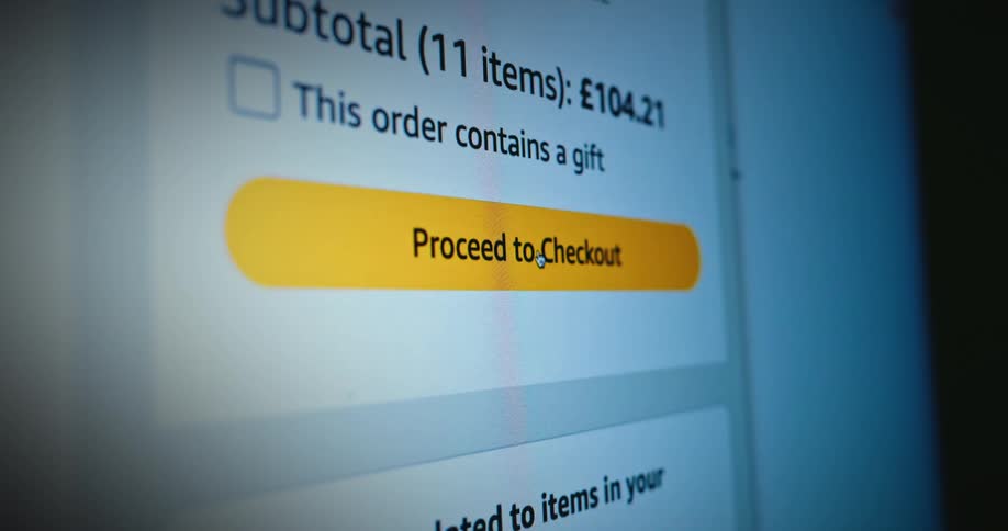A mouse cursor hovers over a proceed to checkout button on an online shopping cart screen with a 10421 subtotal