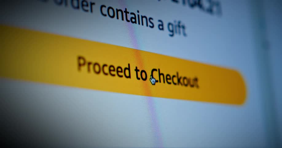 A mouse cursor clicking on a proceed to checkout button on a shopping website