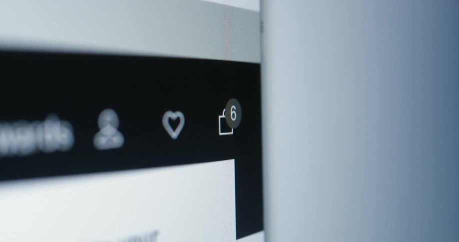 A webpage shows heart and alert icons with new notifications