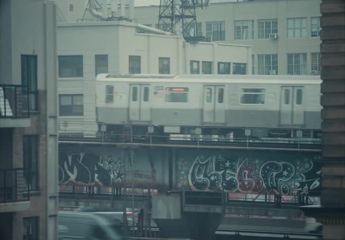 The train travels on the overpass through the city