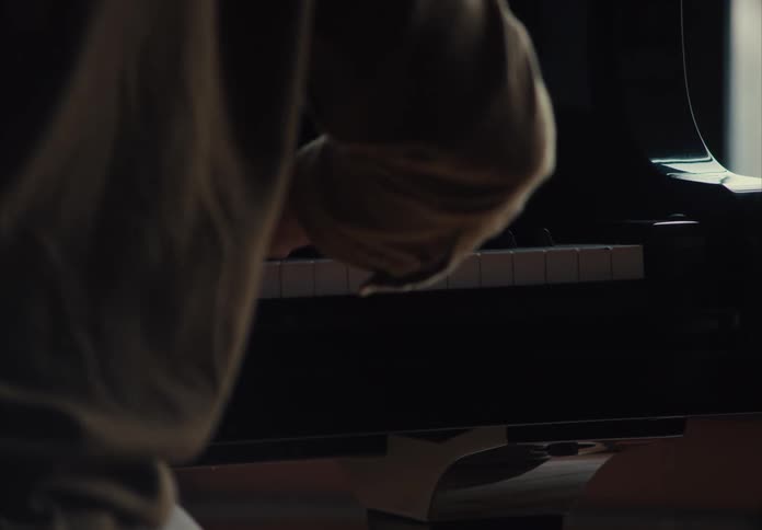 The person is playing the piano