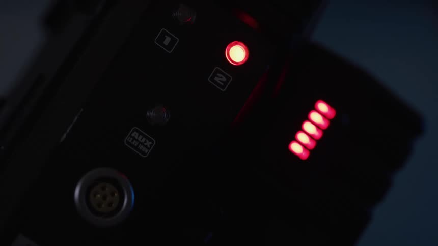 Electronic panel with red and green lights on in equipment