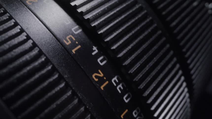 Closeup shows the adjustment ring of a camera lens