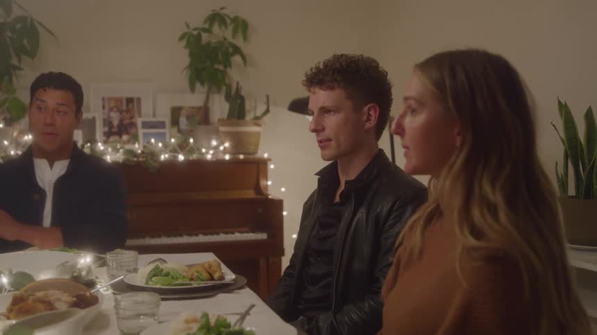 Friends having a conversation around the dinner table