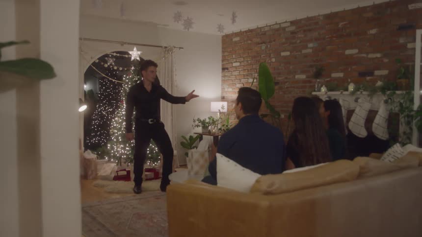 Friends joyfully celebrate christmas with fun games indoors