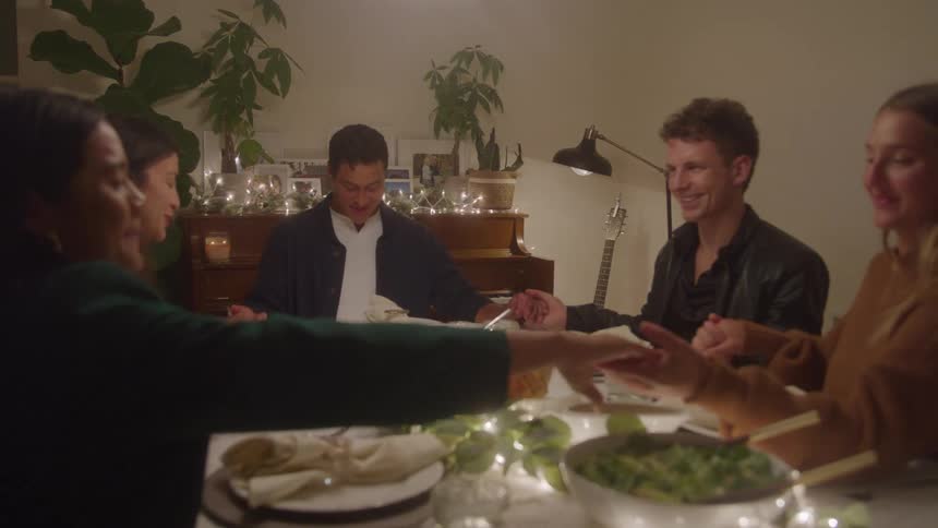 Adult friends celebrating thanksgiving together at home