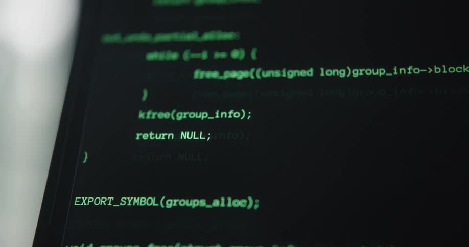 Green computer code appears then scrolls on a black screen