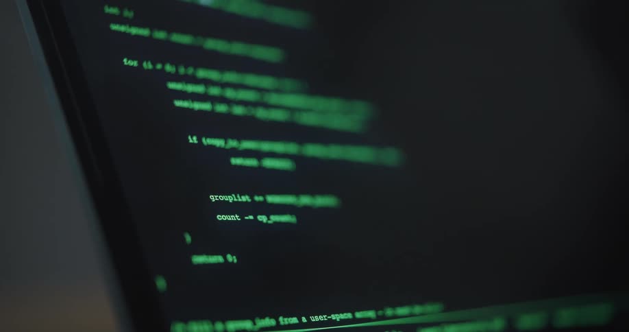 Green computer code is being inputted on the screen