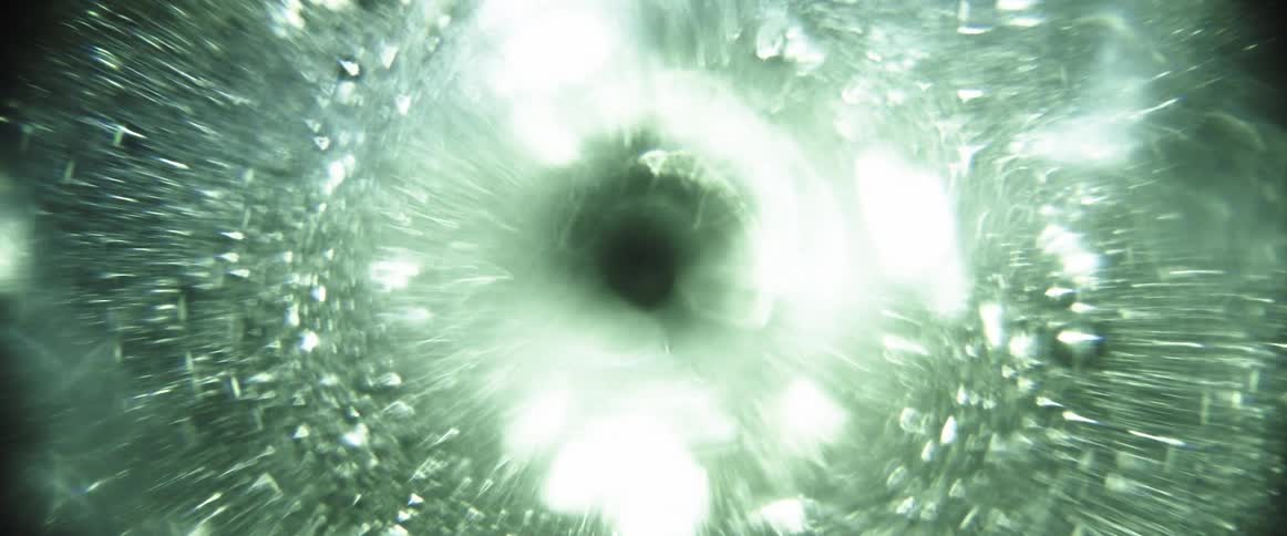 Liquid that is rotating circularly is illuminated by a bright light