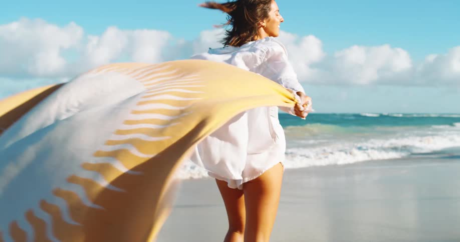 The woman is running on the sand