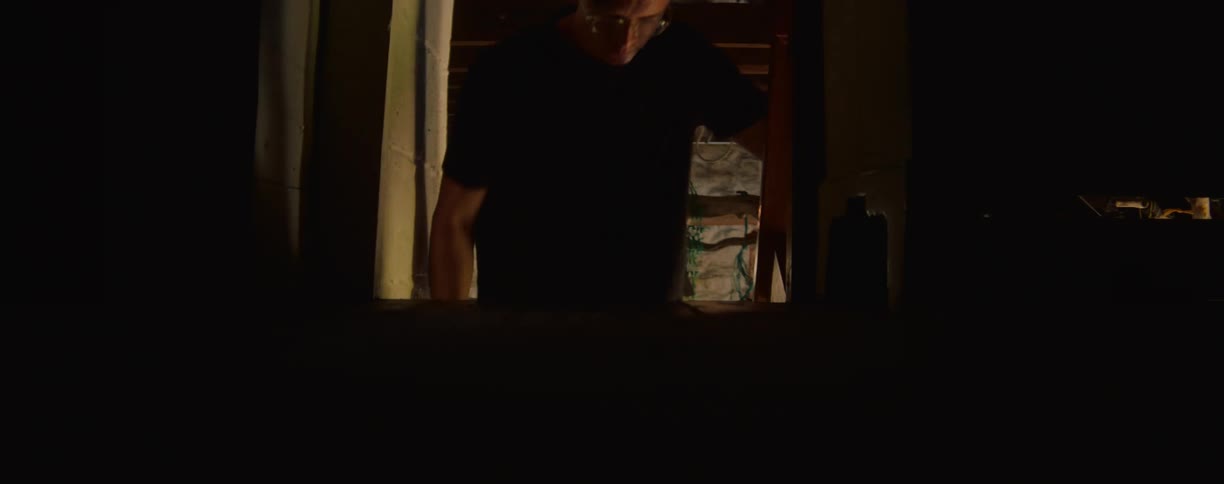 Man descending the stairs inside the house