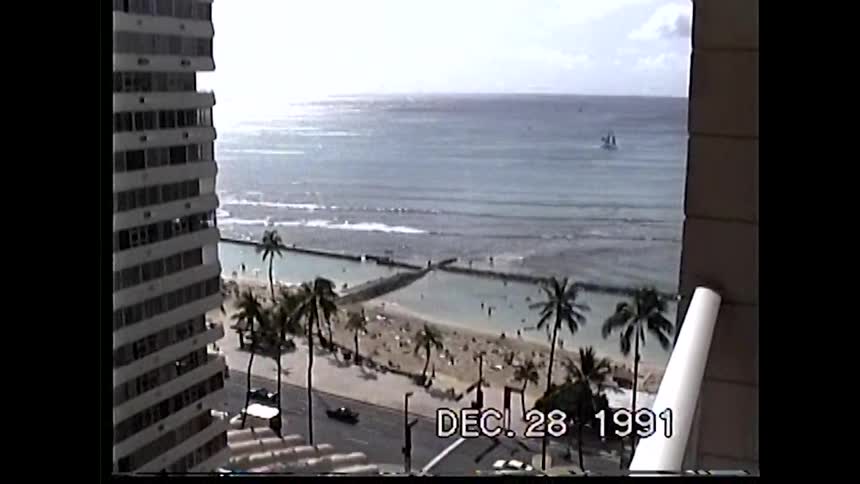 High rise balcony view of a tropical beach and ocean