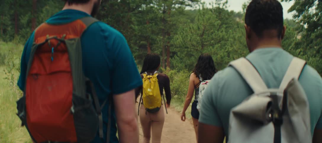 People talk and hike on the trail together