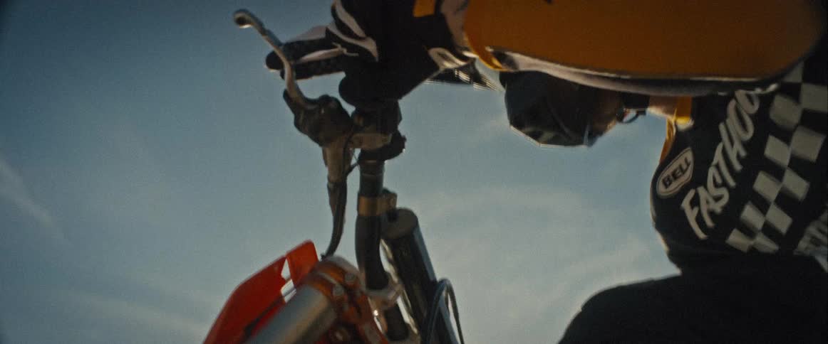 The dirt bike vibrates as it rides