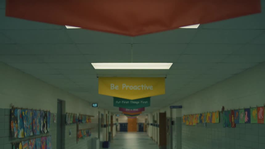 School hallway decorated with childrens drawings and motivational banners