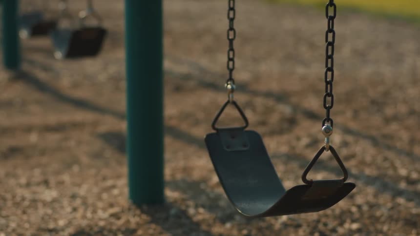 The empty swing blows in the wind