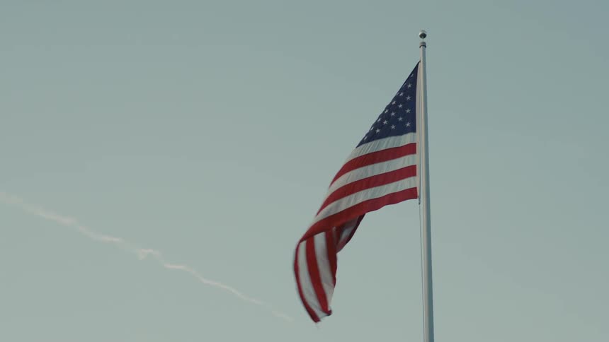 An american flag swaying in the breeze