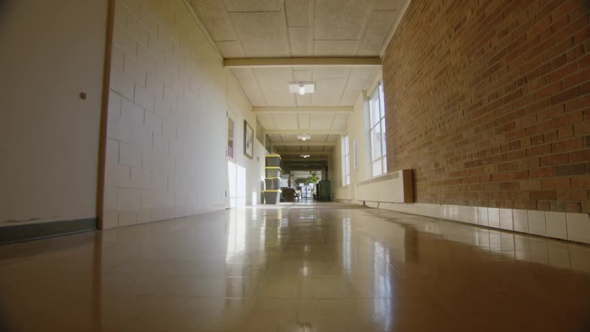 A long deserted hallway in a public building