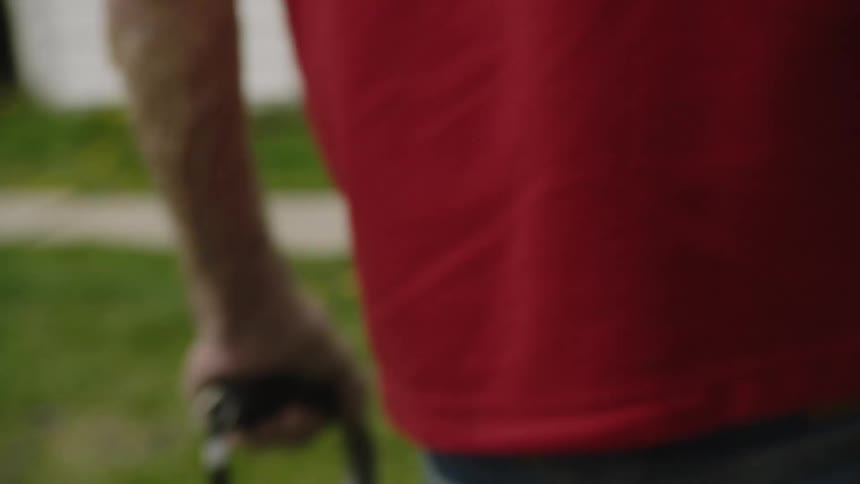 Elderly man holding golf balls