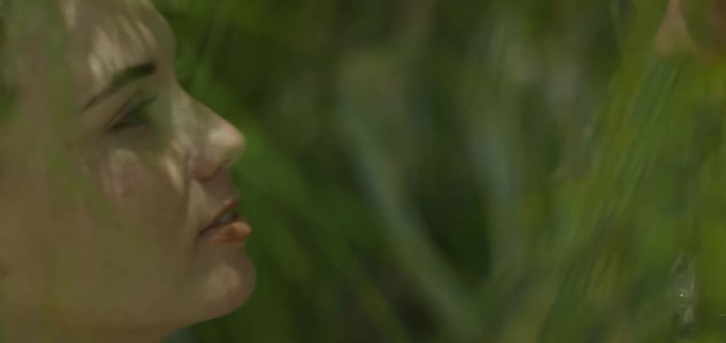 A woman kisses a man