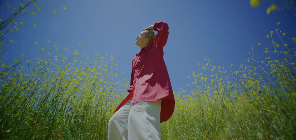 A woman dancing in a field