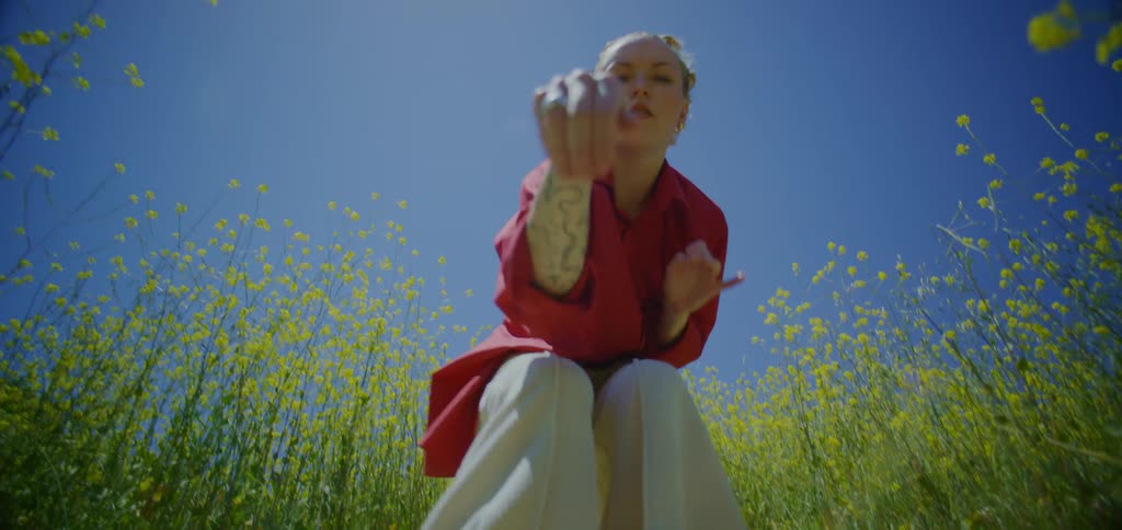 A woman dancing in a field