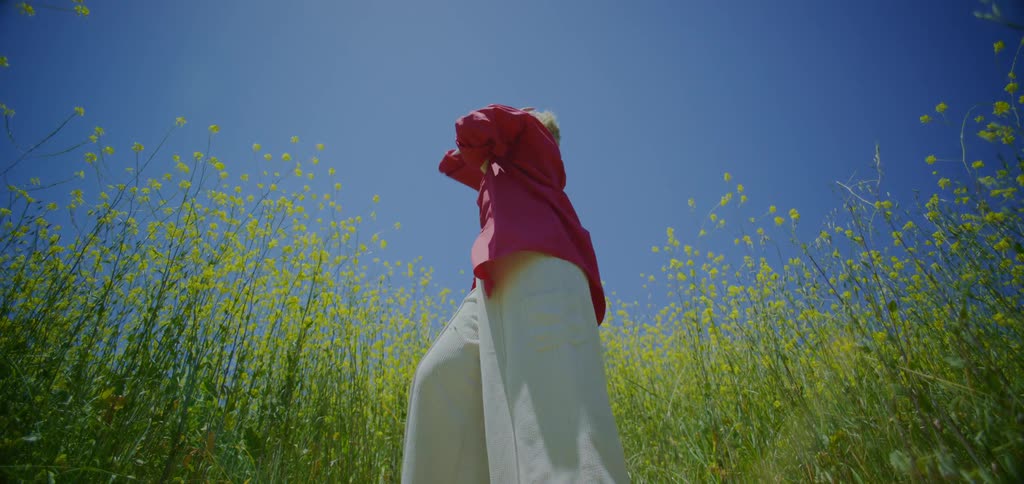 Woman dancing in a field with flowers