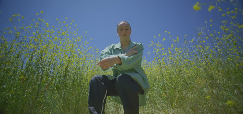 A woman dancing in a field
