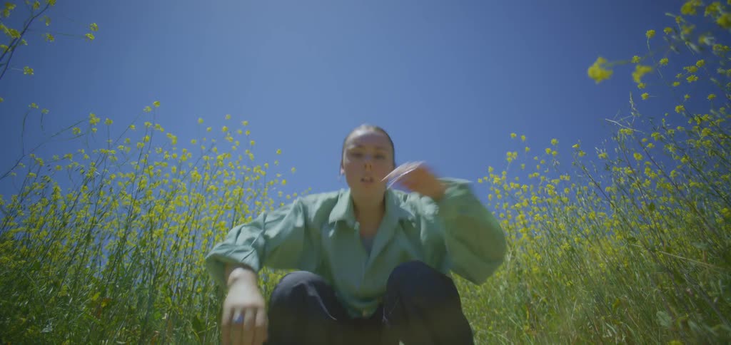 A woman dancing in a field