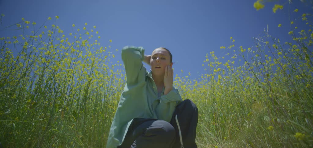 A woman dancing in a field