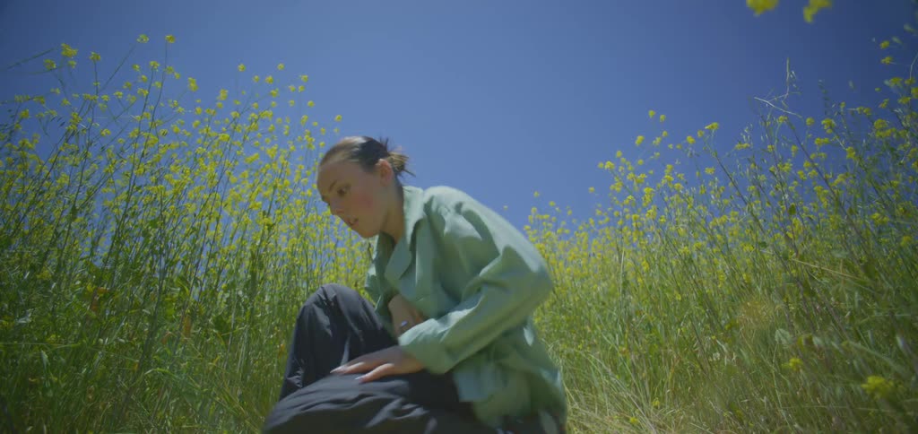 A woman dancing in a field