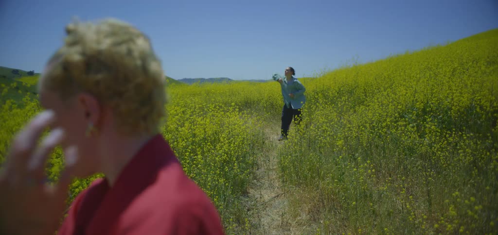 Two women practice tai chi on the small trail