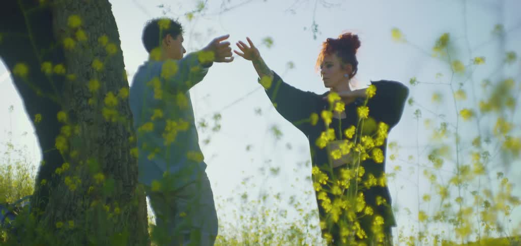 A man and woman are doing tai chi together