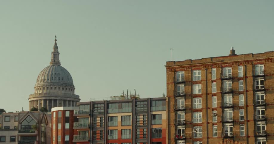Dome of st pauls cathedral in london behind residential buildings
