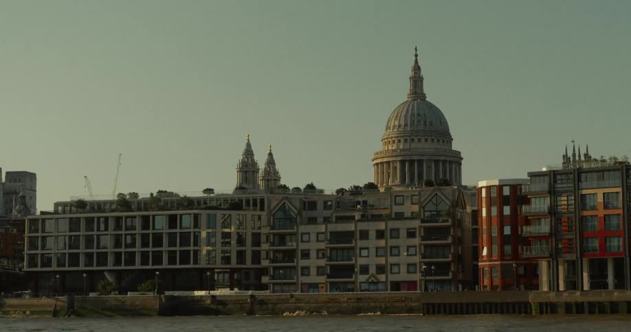 St pauls cathedral dome at dusk surrounded by modern and historic buildings