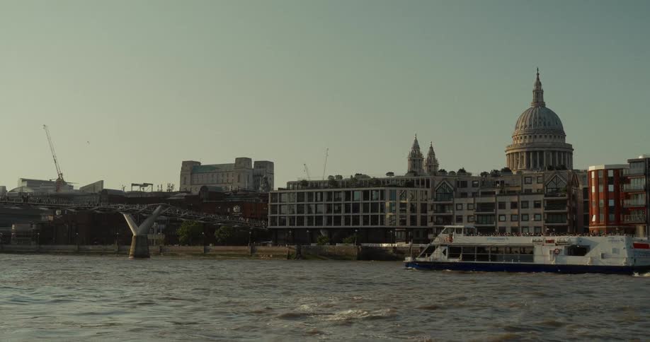 People ride the ferry on the shore of the city