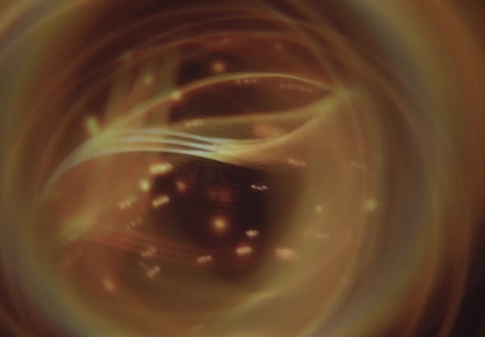 An orange object swirls in a circular motion