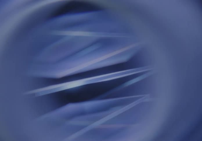 Blurred geometric shapes in shades of blue creating an abstract effect