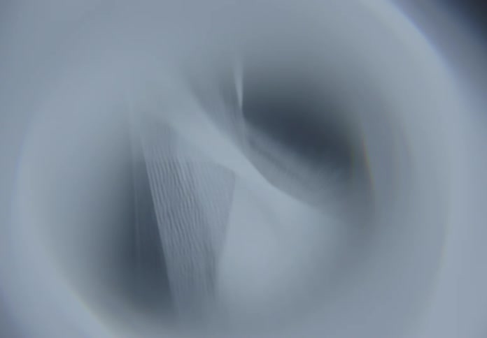 Abstract shapes in shades of gray and blue intersecting in soft layers